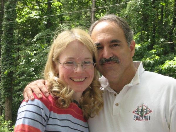 Pat Rinker smiling with his wife Karen outdoors